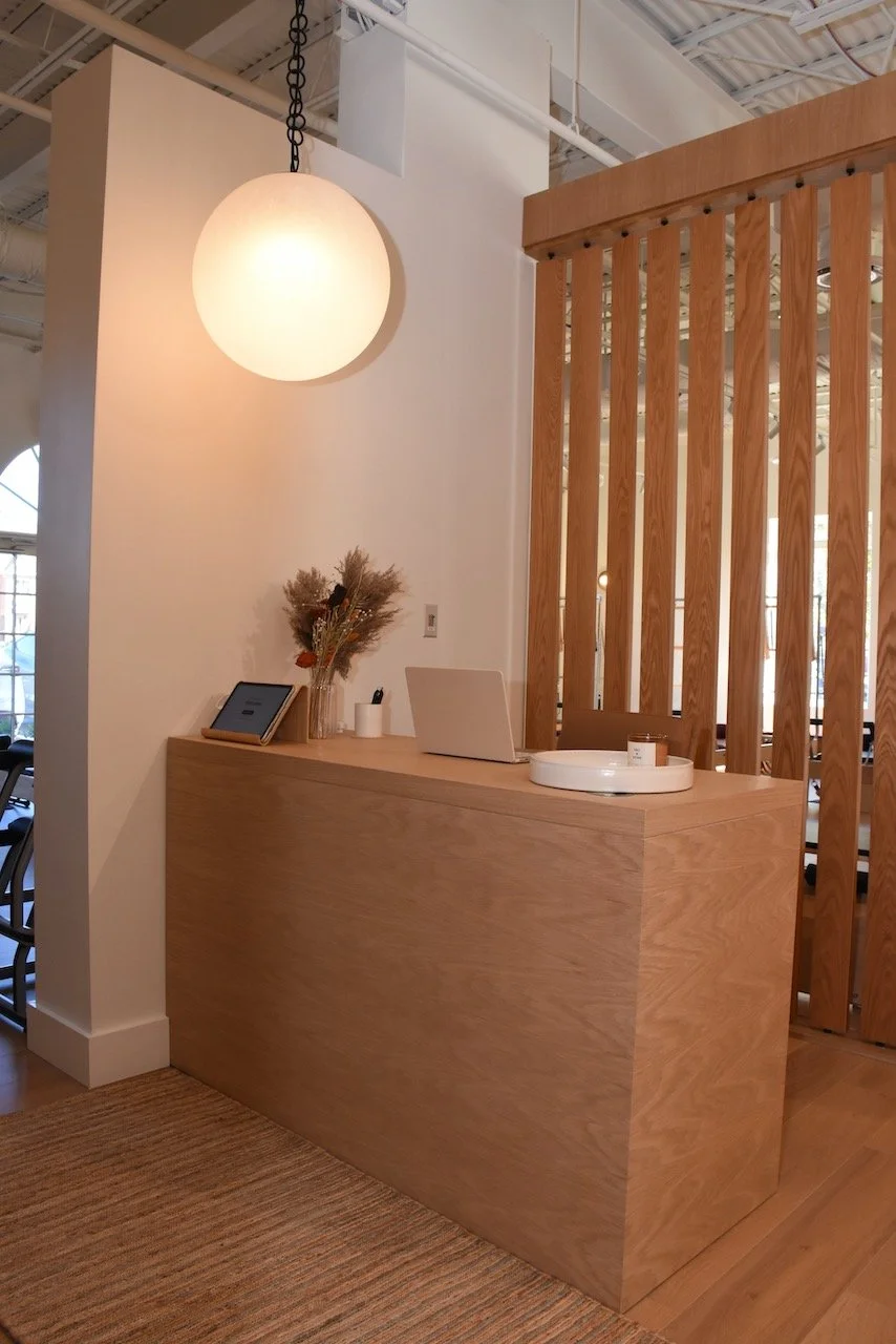GF Movement Center reception area with warm wood and dried flowers.